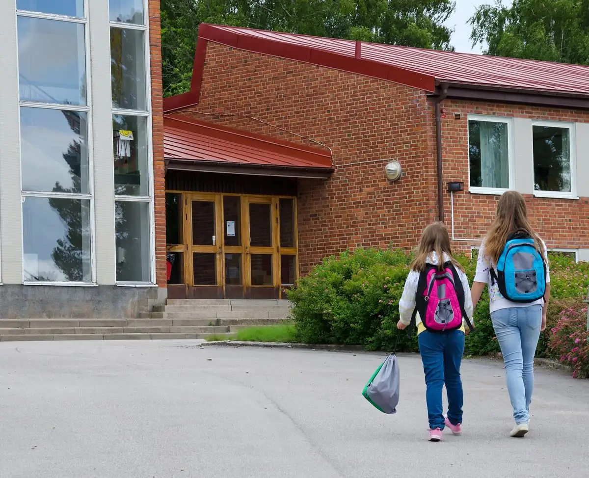 Students walking outside a school building
